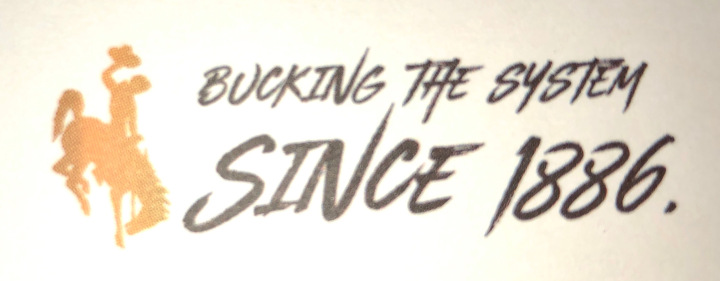 logo of a company with text "bucking the system since 1886"