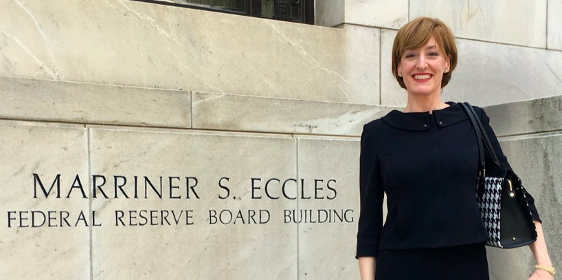 Caitlin Long in front of the Marriner S. Eccles Federal Reserve Board