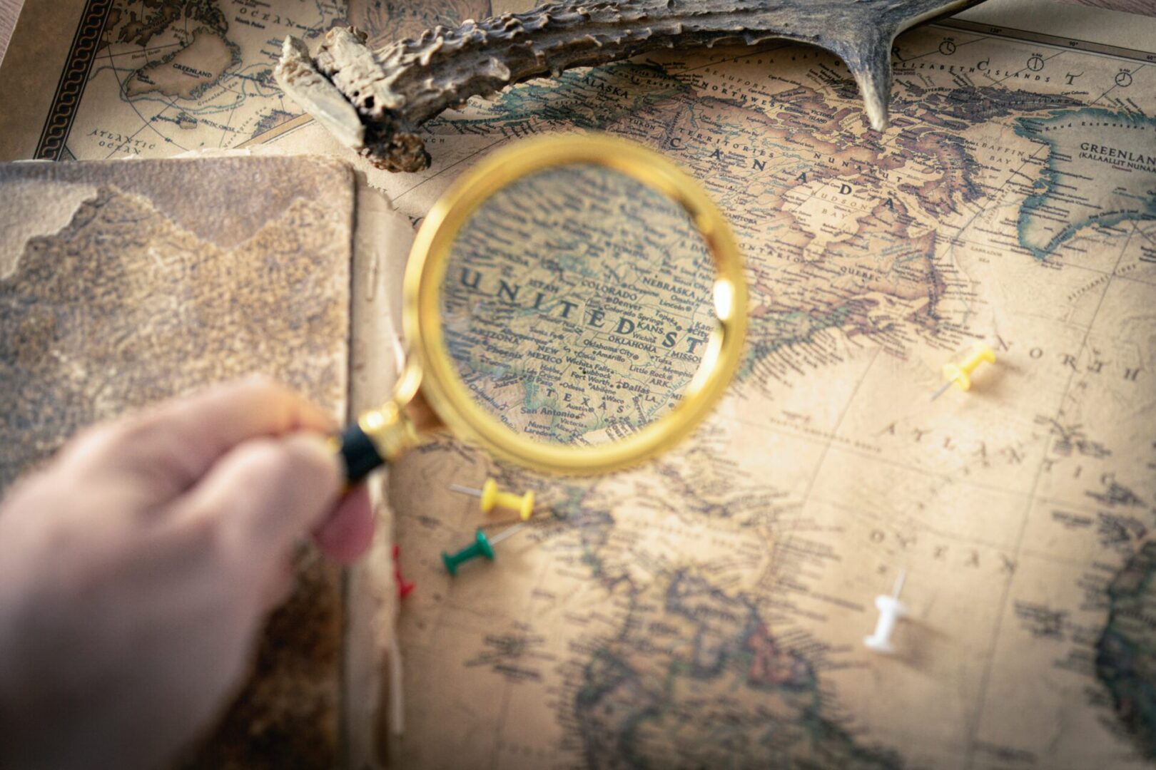 A magnifying glass on the top of the map