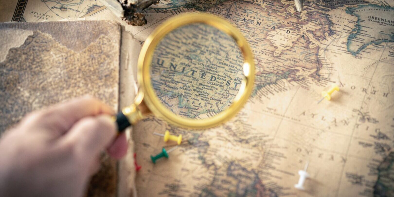 A magnifying glass on the top of the map