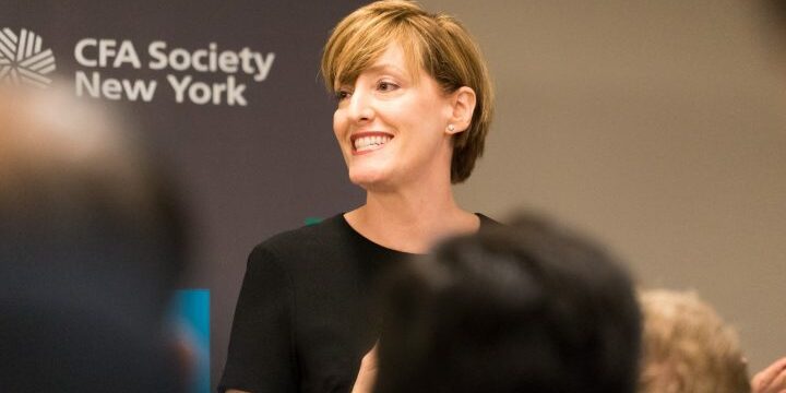 Caitlin smiling while making a speech