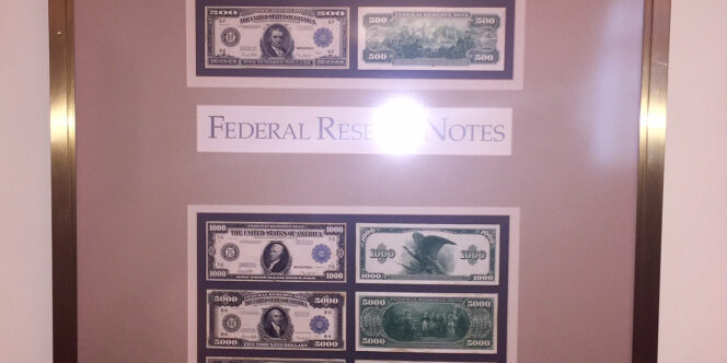 A display of dollar Federal Notes with frame